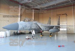 shrink wrapping an F15 Eagle